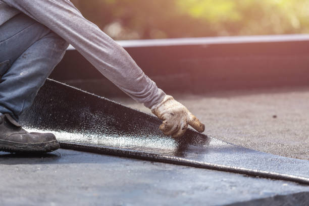 Professional Waterproofing technician working in Medford, NY